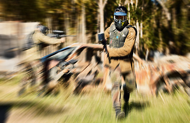 Image showing Soldier, paintball and running with gun for intense battle or war in the forest pushing to attack. Active paintballer rushing or moving fast in extreme adrenaline team sport with weapon or camouflage