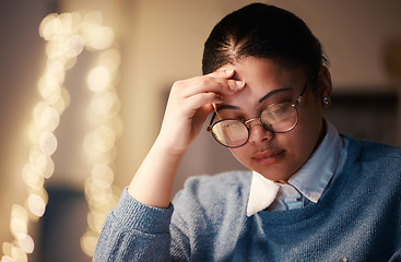 Image showing Hispanic woman, study headache and education burnout of a student with stress. Night thinking, online university project and anxiety of a young female with glasses and blurred background in the dark