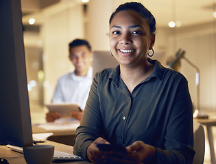 Image showing Night, phone and smile with portrait of woman in office for social media, networking and search. Technology, overtime and internet with girl employee at desk for website, contact and online app