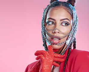 Image showing Chains, rock and goth fashion by woman with unique style isolated against a studio pink background. Creative, accessories and edgy female model metal jewelry on her head and cool makeup