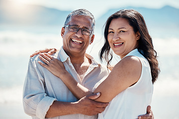 Image showing Love, beach and portrait old couple in embrace, smile on face and romance in happy relationship. Romantic retirement vacation, senior woman and mature man hugging on tropical ocean holiday travel.