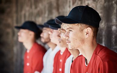 Image showing Baseball, uniform or dugout with a sports man watching his team play a game outdoor during summer for recreation. Sport, teamwork and waiting with a male athlete on the bench to support his teammates