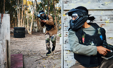 Image showing Paintball, sports and man with gun for battle, game or competition outdoors on field. War fight, military army and male soldier with weapon on shooting range while hiding from opponent for exercise.