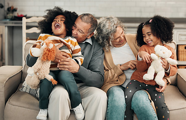 Image showing Children, laughing or family with grandparents and grandkids bonding in the living room of their home. Kids, funny or tickle with a senior man, woman and grandchildren together on a sofa in the house