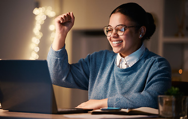 Image showing Business, student or success fist for laptop reading in night office on financial software, investment data or growth analytics. Smile, happy or winner woman on technology in working late achievement