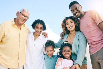 Image showing Hug, happy and portrait of an interracial family with a smile, happiness and care on the lawn. Looking, diversity and parents, grandparents and children with love, smiling and bonding in the garden