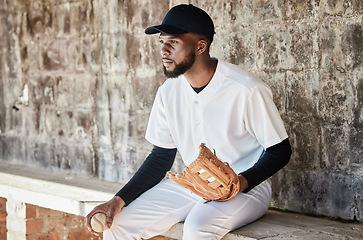 Image showing Black man, baseball or catch glove on sports, stadium or arena bench for game, match or serious competition. Concentration, athlete or softball player mitten for fitness, workout or exercise training