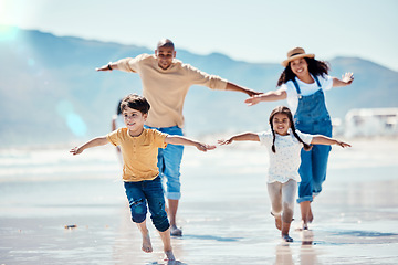 Image showing Family, beach and parents running with children for bonding, quality time and adventure together. Travel, love and happy mom, dad and kids enjoy summer holiday, vacation and relax on weekend by sea