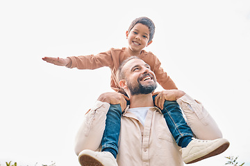 Image showing Family, children and boy sitting on the shoulders of his father outdoor while bonding from below. Fun, kids and love with a man carrying his son outside while spending time together being playful