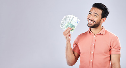 Image showing Asian man, portrait and money fan on isolated background for financial freedom, stock market profit or investment. Smile, happy and trader cash on studio mockup for finance success, savings or growth