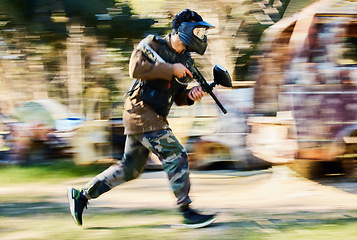 Image showing Fast, running and paintball man, gun and outdoor battlefield, playground or games in forest adventure training. Shooting skill, player or sports person with military speed, action and target mission