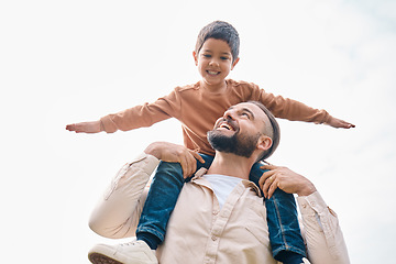 Image showing Family, kids and boy sitting on the shoulders of his father outdoor while bonding from below. Fun, children and love with a man carrying his son outside while spending time together being playful