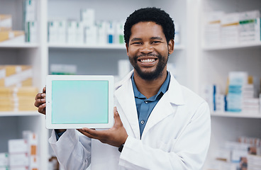 Image showing Pharmacist man, tablet and green screen in mockup portrait for medicine, retail healthcare and wellness. African pharma expert, touchscreen ux and space for sales, health logo or product placement