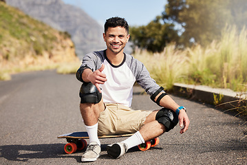 Image showing Young man outdoor, skateboard and skater with fitness on country road with smile in portrait and extreme sport. Happiness, exercise and skating, gen z male and hobby with training and sports