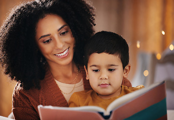 Image showing Night, book and mother with child reading for bedtime storytelling, fairytale and education. Relax, happiness and smile with boy listening to woman at home for learning, creative and literature