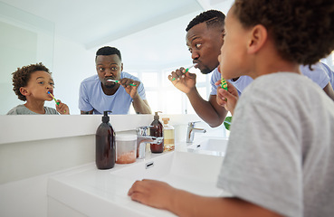 Image showing Learning, brushing teeth and father with son in bathroom for dental, morning routine and cleaning. Teaching, self care and toothbrush with black man and child at home for wellness, fresh and hygiene