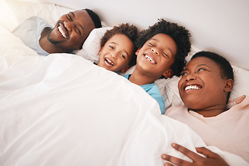 Image showing Funny, happy and relax with black family in bedroom for bonding, wake up and morning routine from top view. Smile, laugh and cute with parents and children at home for calm, weekend and quality time