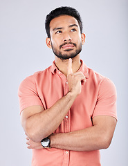 Image showing Thinking, idea and face of man on a white background with thoughtful, contemplating and wondering expression. Question mockup, studio and male pose with ideas, brainstorming and planning mindset