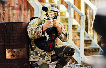 Image showing Paintball, military or man with gun in shooting game playing with on fun battlefield mission. Target, warrior or focused soldier with army weapons gear for survival in outdoor challenge competition