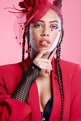 Image showing Punk, gen z and portrait of a young woman with creative, designer fashion or edgy clothing. Serious, pink background and rock latino model with cool, rocker or funky style for beauty in a studio