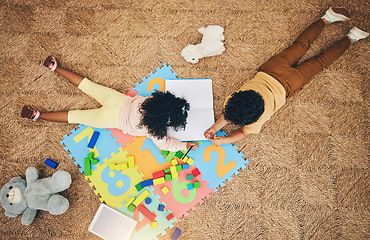 Image showing Top view, numbers puzzle and children on floor with toys, drawing in book and playing together at home. Family, educational games and happy boy and girl do fun activity, creative learning and relax
