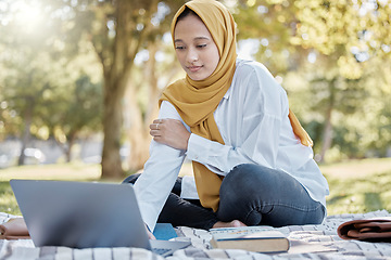 Image showing Muslim, student and woman with laptop in park for elearning, studying or knowledge research. Islamic college, education scholarship and female with computer for internet browsing in university campus