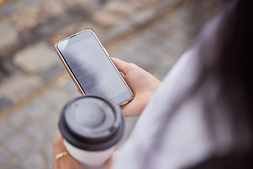 Image showing Phone, coffee and screen with a woman in the city browsing social media or typing a text message from above. Contact, texting and 5g mobile technology with a female person outside in an urban town