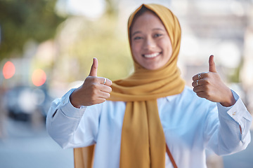 Image showing Thumbs up, positive and portrait of Muslim woman in city for achievement, relax and natural in Indonesia. Islamic, youth and confident with girl wearing hijab in urban town for yes, agreement and joy