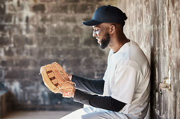 Image showing Stadium, baseball and black man with ball, glove and ready for game, match and practice in dugout. Softball mockup, motivation and happy player prepare for training, exercise and sports competition