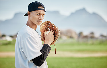 Image showing Portrait pitcher, ready or baseball player training for a sports game on outdoor field stadium. Fitness, softball athlete or focused man pitching or throwing a ball with glove in workout or exercise