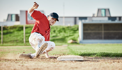 Image showing Baseball, sports and man slide on field for competition, game or practice outdoors. Training, workout and player, athlete or male base runner in action match, exercise and competitive tournament.