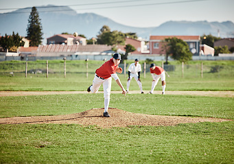 Image showing Baseball player, competitive and athlete throw or pitch ball in a match, game or training with a softball team. Sports, fitness and professional man pitcher in a competition with teamwork