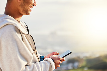 Image showing Fitness man, hands and phone on mockup in social media, chatting or texting for travel, journey or trip in nature. Hand of male typing on smartphone with 5G connection for hiking, GPS or sunset view