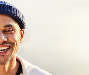 Image showing Half, face and happy man with mockup space by hipster with a fashionable beanie on a simmer day with a smile. Guy, cool and side head of a stylish young male looking confident and excited