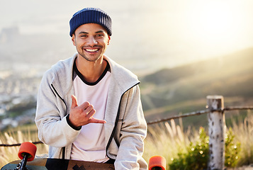 Image showing Smile, portrait of skateboarder with shaka hand gesture and skateboarding hobby and skill on mountain. Freedom, fun and face of cool happy gen z man with happiness, longboard or skateboard and sports