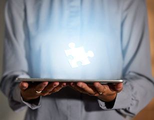 Image showing Hands, tablet and 3D hologram of puzzle piece for planning, strategy or problem solving in technology at night. Hand of business person holding futuristic touchscreen and holographic jigsaw at office