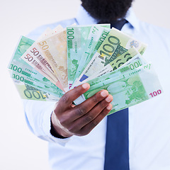 Image showing Finance, money and hands of black man in studio for winner, investment and wealthy. Success, payment and profit with male holding cash isolated on white background for cashback, salary and rich