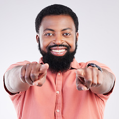 Image showing Happy, pointing and portrait of black man in studio for yes, opportunity and decision. Yes, smile and deal with male and gesture isolated on gray background for agreement, thank you and choice