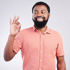 Image showing Perfect, happy and okay sign with black man in studio for deal, success and good news. Thank you, agreement and emoji with male isolated on gray background for celebration, opinion and confidence