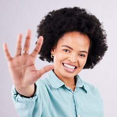 Image showing Happy, smile and hand with portrait of black woman in studio for confidence, positive and relax. Happiness, stretching and palm with female on gray background for cheerful, carefree and friendly