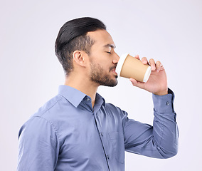 Image showing Coffee, morning and businessman in a studio drinking a cappuccino before his corporate job. Professional, caffeine and male employee enjoying an espresso in takeaway cup isolated by gray background.