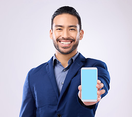 Image showing Portrait, mockup and Asian man with smartphone, green screen and happiness against grey studio background. Face, Japanese male ceo and employee with cellphone, space and social media with connection