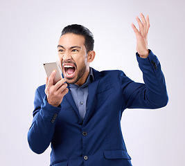 Image showing Screaming, angry and phone with man in studio for communication, frustrated and connection. Bad news, problem and corporate with male isolated on white background for difficult, annoyed and failure