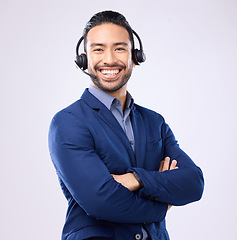 Image showing Portrait, customer service and arms crossed with a man consultant standing in studio on a gray background. Contact us, support and headset with a male telecom worker ready to help for assistance