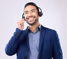 Image showing Thinking, customer service and smile with a man consulting using a headset for support in studio on a gray background. Idea, contact us and crm with a happy male consultant talking over a microphone