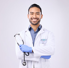 Image showing Portrait, Asian man and doctor with stethoscope, success and motivation against grey studio background. Face, employee and medical professional with happiness, healthcare and consultant with wellness