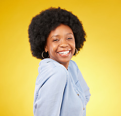 Image showing Black woman, happy face and smile portrait in studio while excited on yellow background. African female model with afro hair, beauty and happiness on color space with motivation and positive mindset