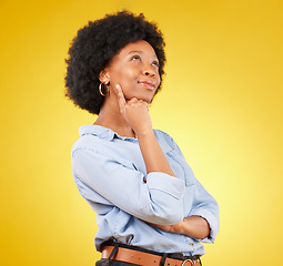 Image showing Black woman, thinking face and smile in studio with idea or memory on yellow background. African female think of space with afro hair, beauty and happiness for motivation and mindset for planning