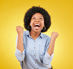 Image showing Black woman, excited face and celebrate win in studio while happy on yellow background. African female model with hands or fist for victory, promotion or bonus lottery prize achievement or surprise