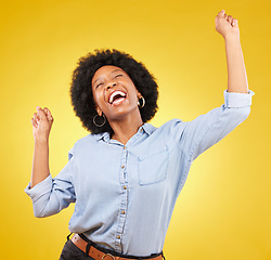 Image showing Happy, cheering and excited black woman with freedom isolated on a yellow background in a studio. Smile, success and an African girl in celebration of an achievement, promotion or winning a prize